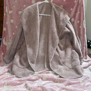 Pink fluffy woman’s cardigan